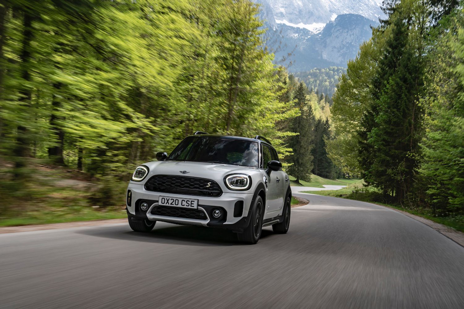 Mini Countryman PHEV exterior front driving in forest